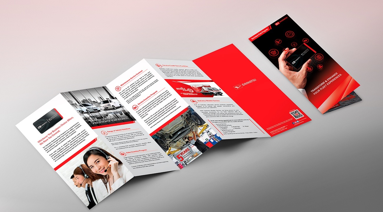 Unfolded brochure containing information about Daihatsu’s Business Fleet Program with an image of women wearing headphones