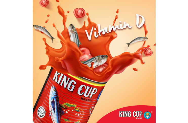 Opened King Cup sardines can with tomato sauce and a few sardine fishes flowing out of it