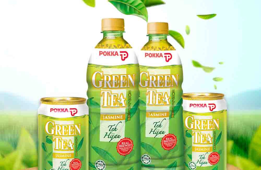 Range of POKKA Green Tea on top of tree with greenery background