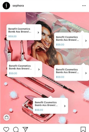 An Instagram post showing Sephora beauty products with multiple tags that contains product info and prices. A box of beauty products in the background has a picture of a female model on it